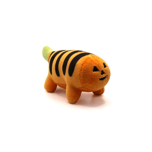 plush pumpkin puff tiger with a jack-o-lantern inspired face, orange body with black stripes, and green tail