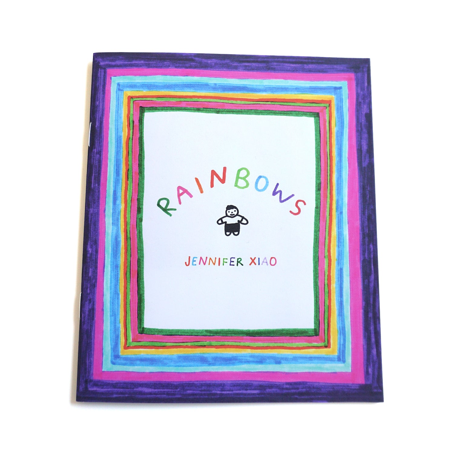 Zine with a rainbow border all around the cover that has the title "Rainbows" written above a small character with the artist name "Jennifer Xiao" written below that